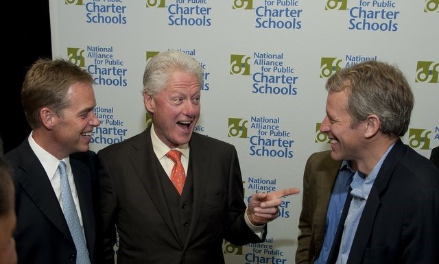 Whitney Tilson and Bill Clinton.